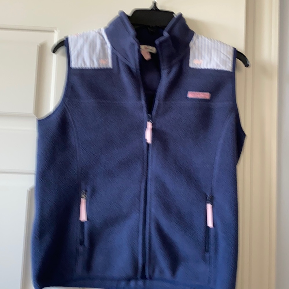 Navy blue with light blue and white strips in front and back with Wales on it.